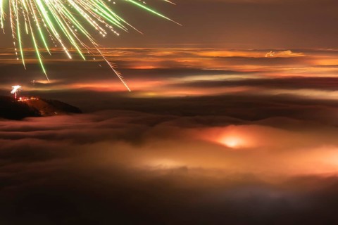 New Year's Eve fireworks 2024 and a little red Aurora Borealis Northern Lights. On the
