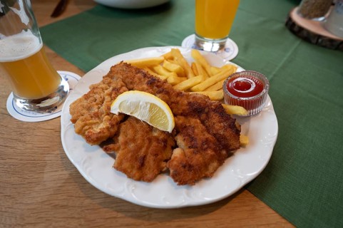 Wiener Schnitzel with French fries served in a pub, Bavaria, Germany, Europe
