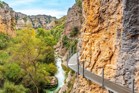 Metal walkways on the wall of the path next to the Vero River in Alquezar. Pyrenees
