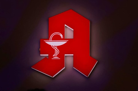 Night shot, logo, red neon sign, pharmacy sign with Aesculapian staff, Aesculapian staff,