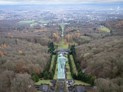 Copper statue of Hercules in Bergpark Wilhelmshöhe with a view over Wilhelmshöhe Palace and