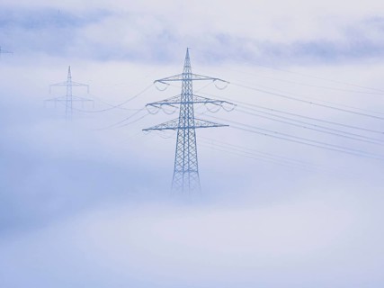 Power lines protrude through dense fog, creating a calm and mysterious atmosphere, Jettingen, Black