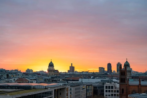 City view at sunset, Friedrichswerder Church, behind German Cathedral and French Cathedral, view