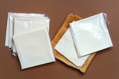 Cheese slices with toast, processed cheese in packaging