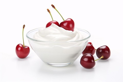 Bowl with yogurt and cherry fruits on white background. KI generiert, generiert, AI generated