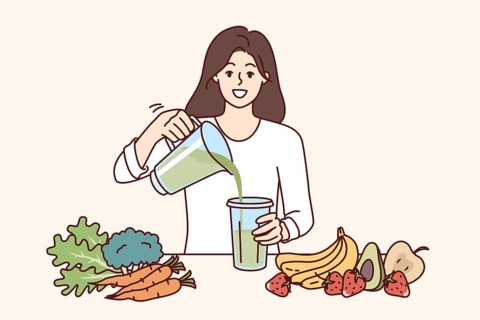 Woman drinks diet smoothie made in blender from organic fruits and vegetables with healthy vitamins