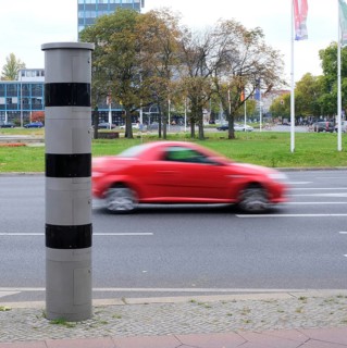 Berlin, Germany, October 13, 2022, speed camera column at Ernst-Reuter-Platz with passing blurred