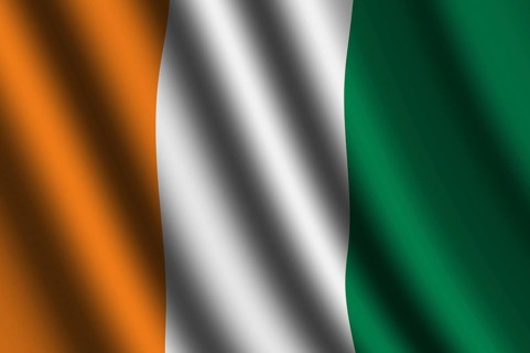 The Republic of Ivory Coast flag flying in the wind