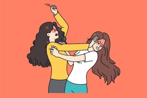 Pair of angry young women fight and quarrel. Mad teenage girls fighting pulling hair. Female