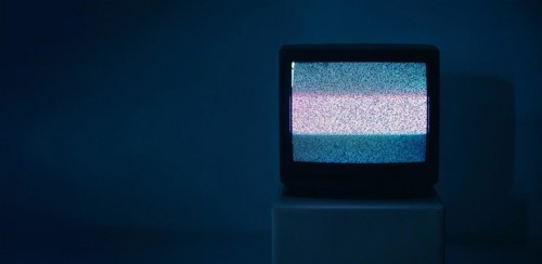 No TV signal on old television with copy space on dark background. Interference, television noise.