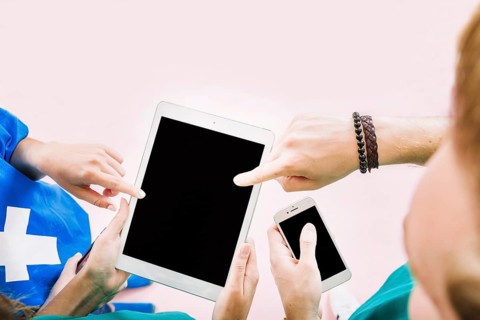 Friends holding tablet hand