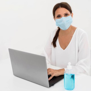 Woman wearing medical mask hand sanitizer