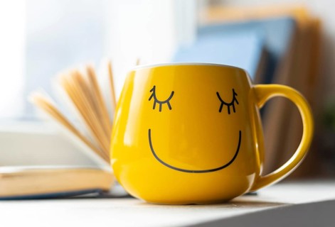 Open book smiley yellow cup