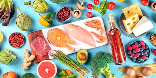 Food, overhead panorama on a blue background. Meat, fish, seafood, poultry, wine, cheese,