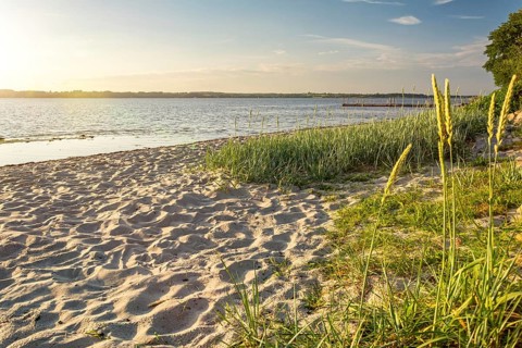 Sunset on a quiet beach in Glücksburg on the Flensburg Fjord in northern Germany