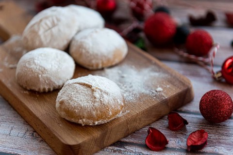 Traditional delicious Greek almond snow balls or Christmas cookies called kourabiedes with almonds