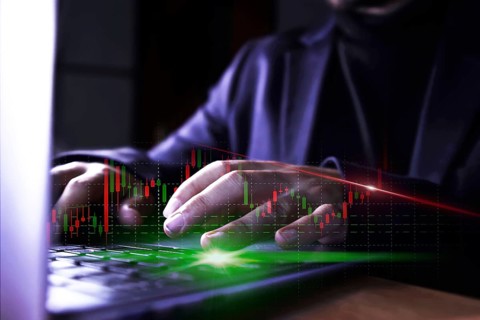 Businessman using computer with stock market virtual increasing stock market graph chart. Business