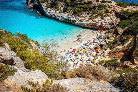 Calo des Moro, Mallorca on a sunny day with people on the beach
