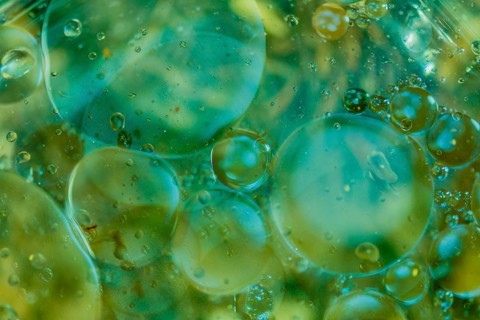 Abstract oil in water using natural light in blue and green tones. Good for wallpaper or background