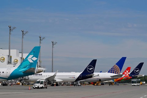 Various Lufthansa, Air Dolomiti, United Airlines, Air Malta, aircraft at check-in position in front
