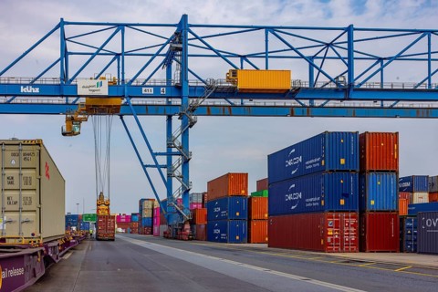 Crane loads containers onto trains and lorries at the D3T container port, Logport l, Rhine,
