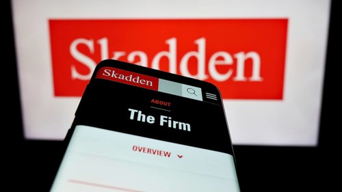 Stuttgart, Germany, 12-17-2023: Mobile phone with website of US law firm Skadden, Arps, Slate,