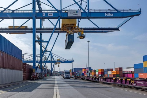 Crane loads containers onto trains and lorries at the D3T container port, Logport l, Rhine,