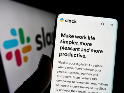 Stuttgart, Germany, 12-30-2022: Person holding cellphone with webpage of US software company Slack