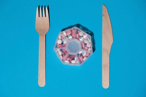 Organizer weekly shots with fork and knife medical pill box with doses of tablets for daily take