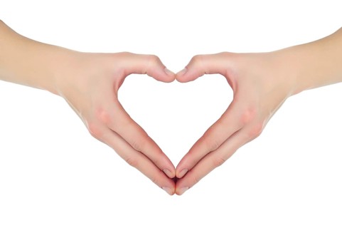 Female hands in the form of heart isolated on white background