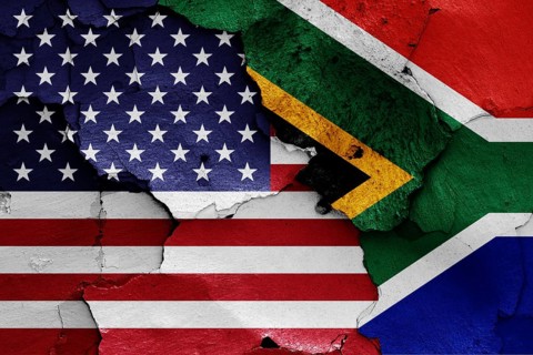 Flags of USA and South Africa painted on cracked wall