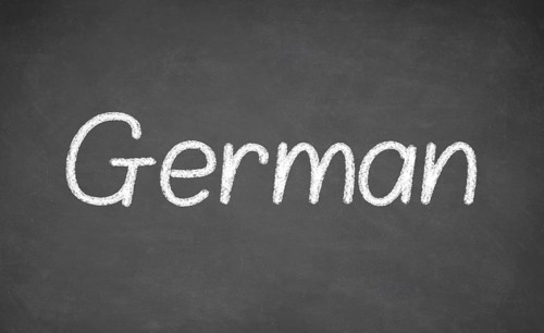 German lesson on blackboard or chalkboard. written in white chalk