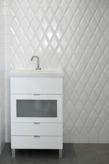 Toilet sink in a white room diamond shape tiles modern vintage bathroom