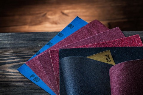 Sandpaper assortment on vintage wood background