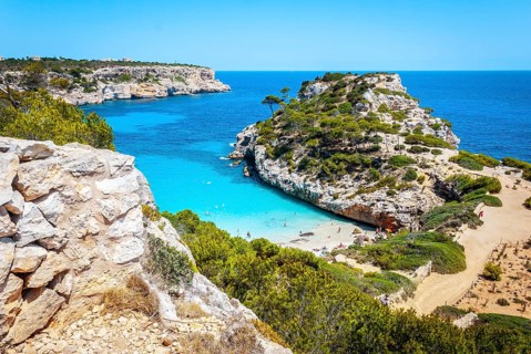 Calo des Moro, Mallorca on a sunny day with people on the beach