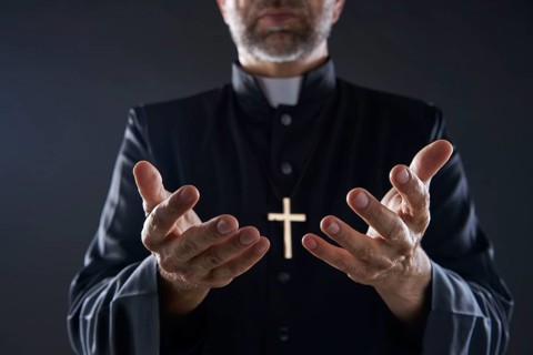 Priest open hands arms praying offering oblation