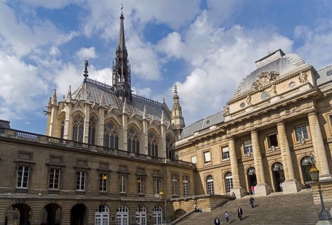 Sainte-Chapelle towers over the buildings of the Palais de Justice. Paris, France, Europe