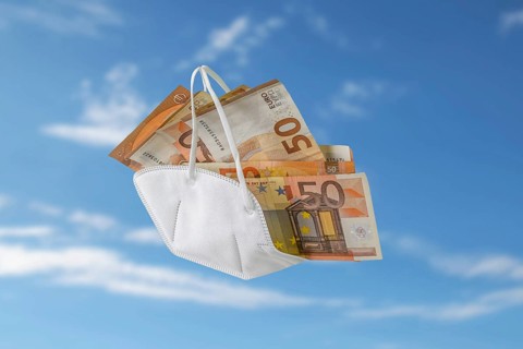 Medical ffp2 face mask against covid-19 filled like a bag with euro banknotes, concept for