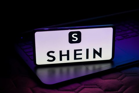 In this photo illustration, the Shein logo is displayed on a smartphone screen
