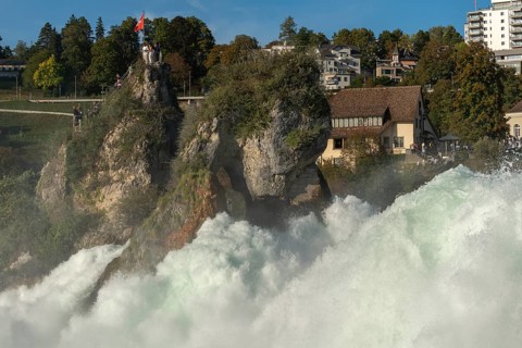 Rhine Falls seen from Laufen Castle, rocky island, Swiss flag, spray, Canton Zurich, on Neuhausen,
