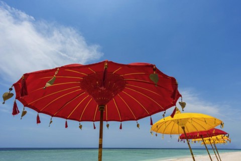 Traditional Balinese temple sunshade as parasol, Hinduism, symbol, beach holiday, protection, sun