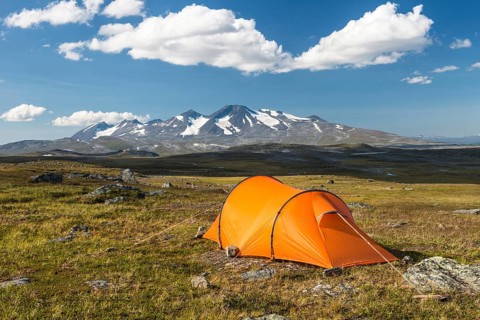 Tent with a view of the Acre Massif, Stora Sjöfallet National Park, Laponia World Heritage Site,