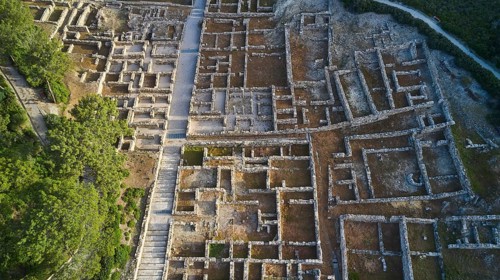 Drone shot, first morning light, Close aerial view of an ancient ruins site, detailed walls and