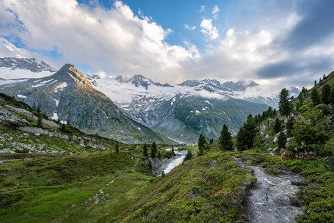 Mountain landscape with mountain stream Zemmbach and mountain hut Berliner Hütte, behind mountain