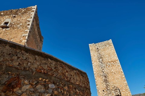 Medieval tower reaching up into a clear blue sky, Flomochori, residential tower village, Mani