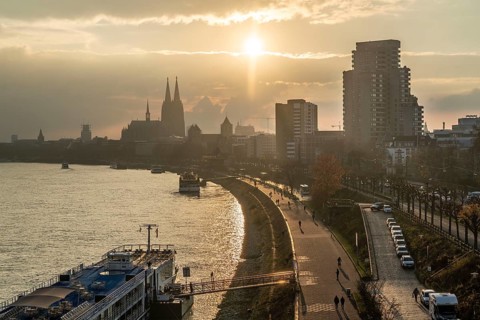 The Rhine near Cologne, sunset, Cologne Cathedral, cargo ship, North Rhine-Westphalia, Germany,