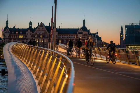 Cyclists on the Lille Langebro cycle and pedestrian bridge over the harbour, Copenhagen is
