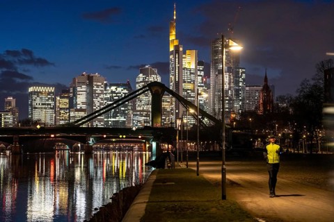 Skyline of the city centre of Frankfurt am Main, joggers on the pavement, promenade along the river
