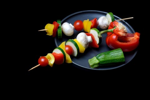 Colourful vegetable skewers on a plate, barbecue skewers