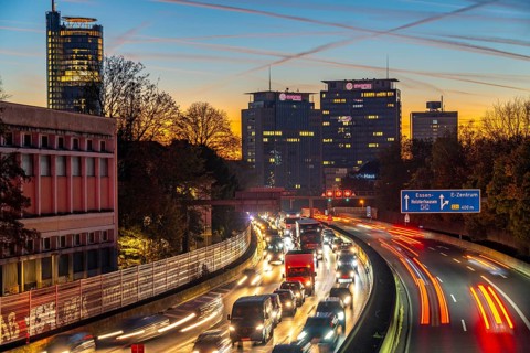 Evening traffic, partly with traffic jams, slow-moving traffic on the A40 motorway, skyline of